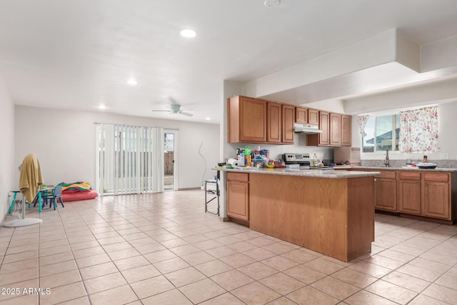 kitchen featuring stainless steel range with electric stovetop, under cabinet range hood, recessed lighting, a peninsula, and light tile patterned floors