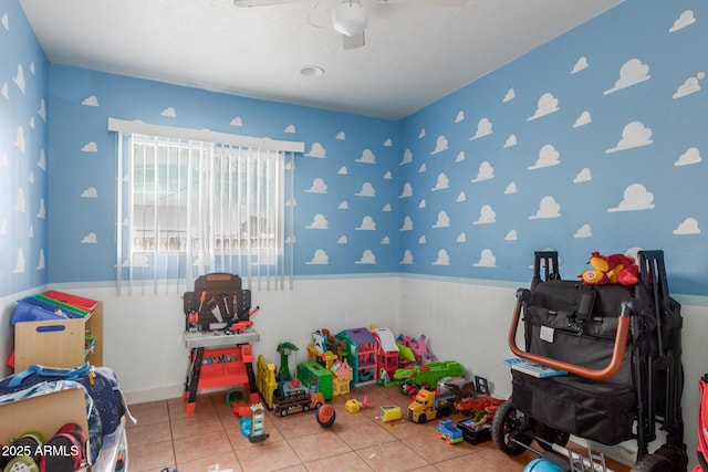 playroom featuring tile patterned floors and ceiling fan