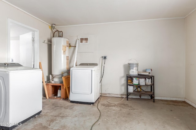 clothes washing area featuring washing machine and dryer, gas water heater, laundry area, and ornamental molding