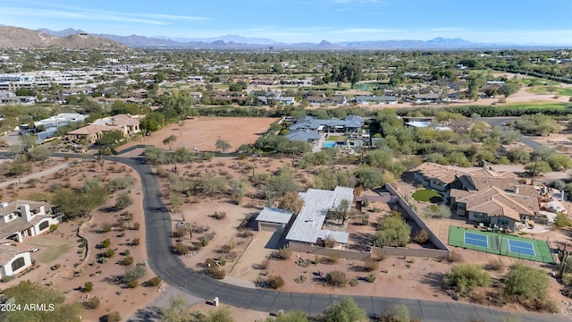 birds eye view of property with a mountain view