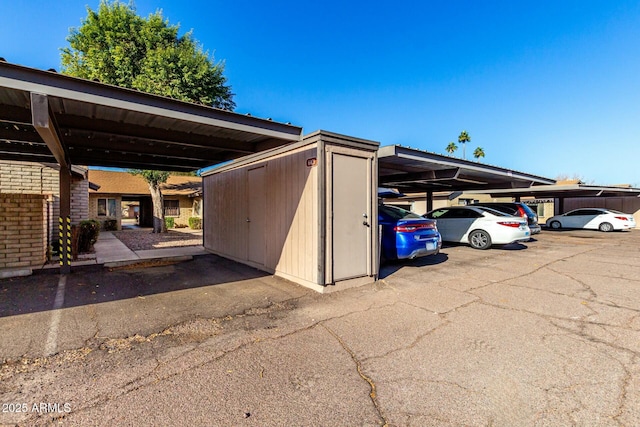 view of parking / parking lot featuring a carport