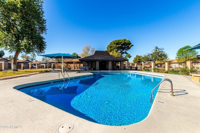 view of swimming pool with a patio