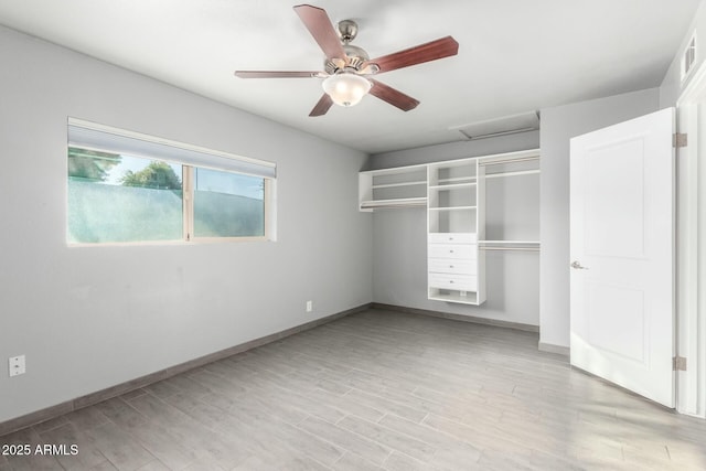 unfurnished bedroom with ceiling fan, a closet, and light hardwood / wood-style flooring