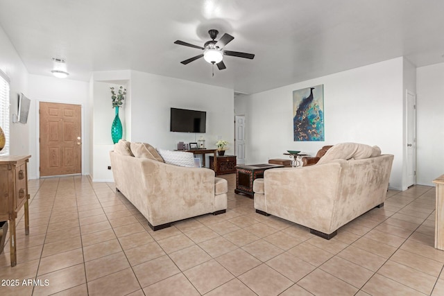 living room with ceiling fan and light tile patterned flooring