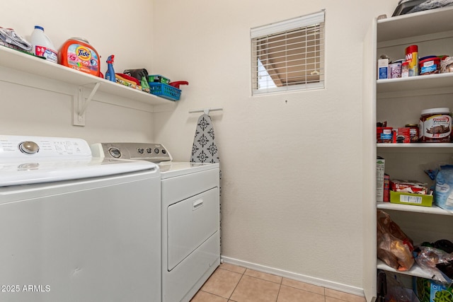 washroom with light tile patterned floors and independent washer and dryer