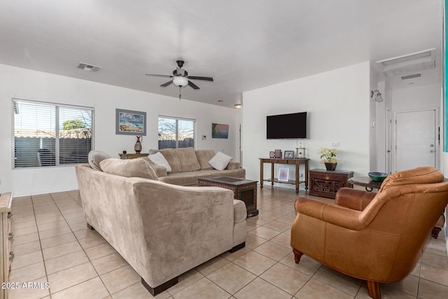 tiled living room featuring ceiling fan