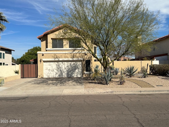 view of front of home featuring stucco siding, an attached garage, fence, driveway, and a tiled roof