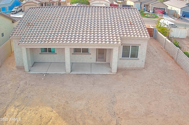 rear view of house with a patio