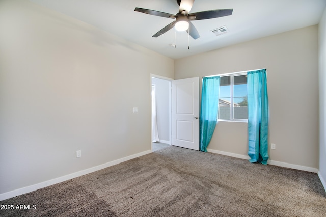 empty room with carpet floors and ceiling fan