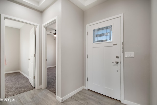 foyer entrance featuring ceiling fan and light hardwood / wood-style floors