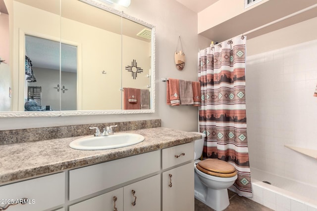 bathroom featuring vanity, toilet, and a shower with shower curtain