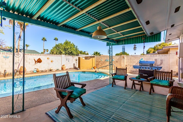 view of swimming pool featuring a grill