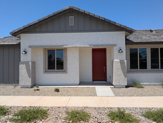 9416 E Sequence Ave, Mesa, AZ 85212 - view of front of house with a tiled roof, board and batten siding, and stucco siding