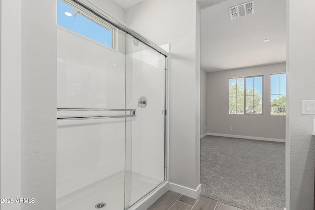 9416 E Sequence Ave, Mesa, AZ 85212 - bathroom with a shower stall and wood finished floors