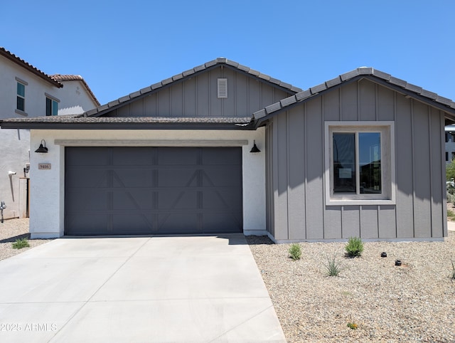 9416 E Sequence Ave, Mesa, AZ 85212 - view of front of house with board and batten siding, a garage, concrete driveway, and a tiled roof
