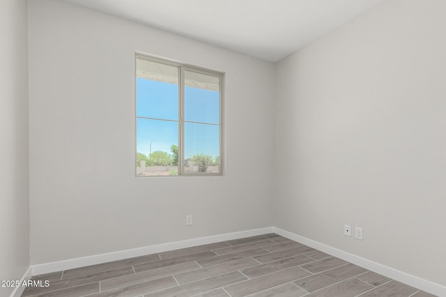 9416 E Sequence Ave, Mesa, AZ 85212 - unfurnished room featuring wood finished floors and baseboards