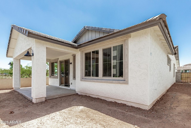 9416 E Sequence Ave, Mesa, AZ 85212 - back of house with a patio, stucco siding, and board and batten siding