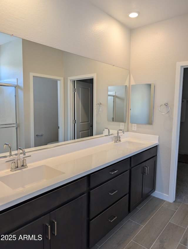 9416 E Sequence Ave, Mesa, AZ 85212 - full bathroom with double vanity and wood tiled floors