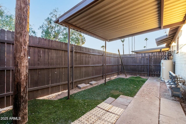 view of yard featuring water heater