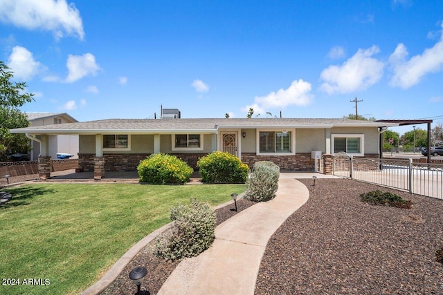 ranch-style home with a front lawn