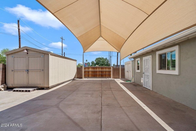 view of patio with a shed