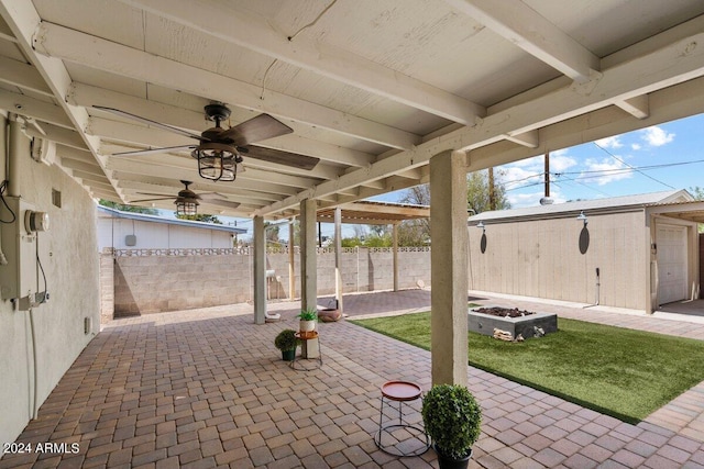 view of patio with an outbuilding and ceiling fan