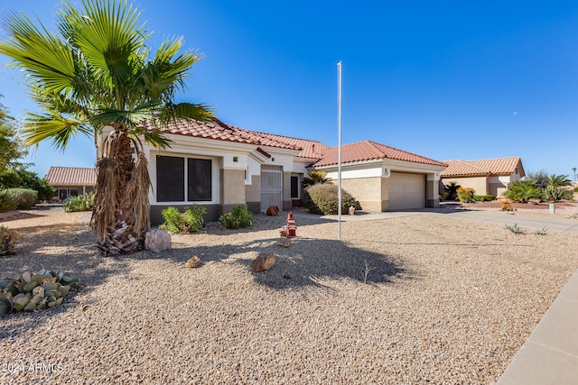 mediterranean / spanish-style house featuring a garage