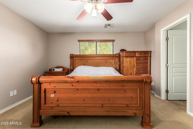 bedroom featuring visible vents, baseboards, and light colored carpet