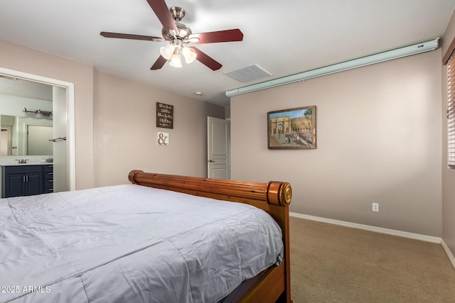 bedroom with carpet, visible vents, baseboards, ensuite bath, and ceiling fan