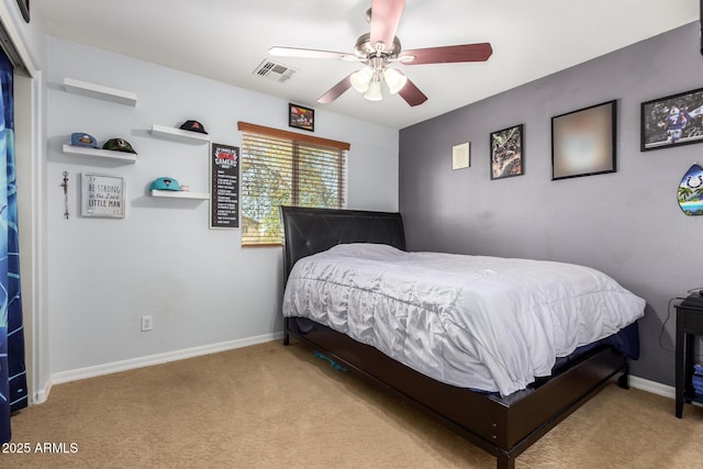 bedroom featuring visible vents, baseboards, carpet, and a ceiling fan