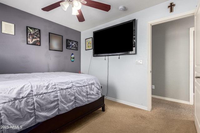 bedroom with carpet flooring, a ceiling fan, and baseboards