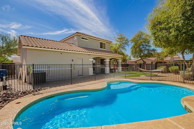 view of swimming pool featuring a patio, fence, and a fenced in pool