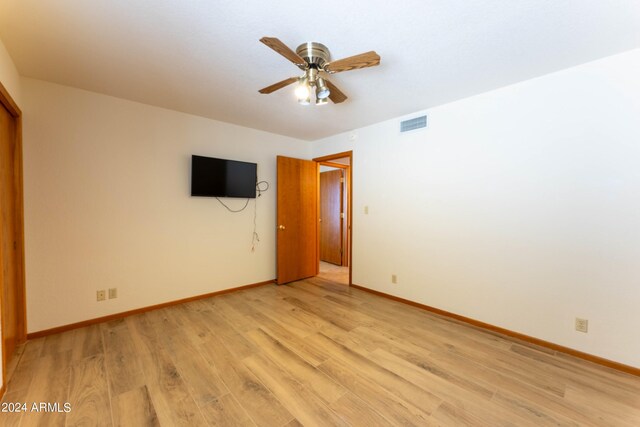 unfurnished bedroom with light hardwood / wood-style flooring and ceiling fan