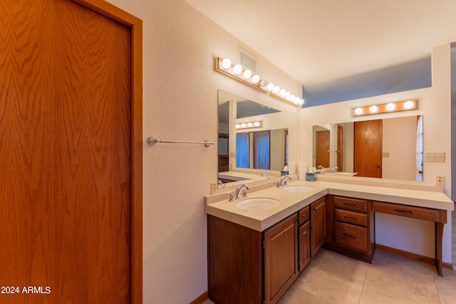 bathroom featuring vanity and tile patterned flooring