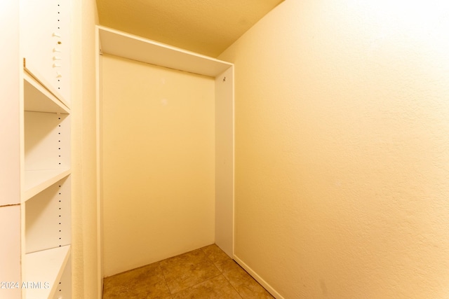 walk in closet featuring tile patterned flooring