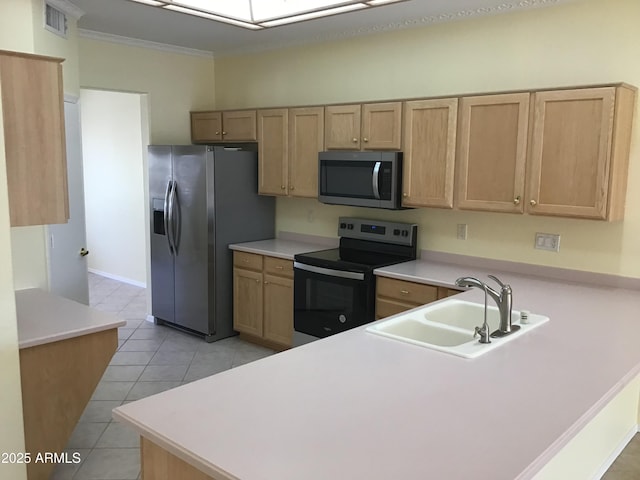 kitchen featuring a peninsula, light countertops, visible vents, stainless steel appliances, and a sink