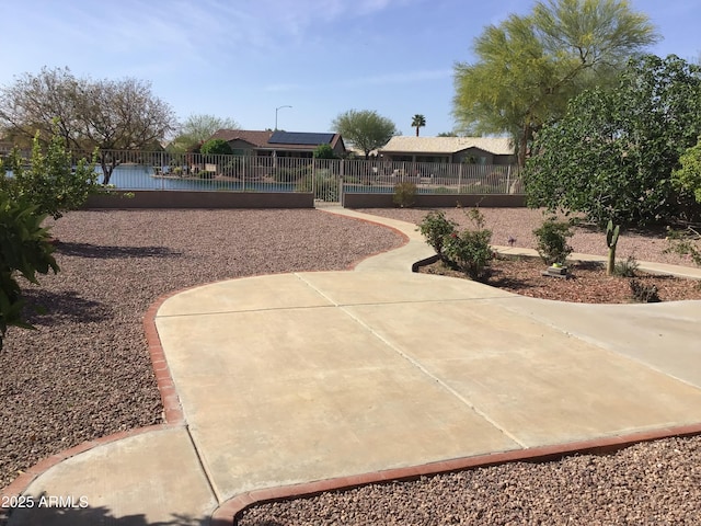 view of home's community featuring a fenced front yard