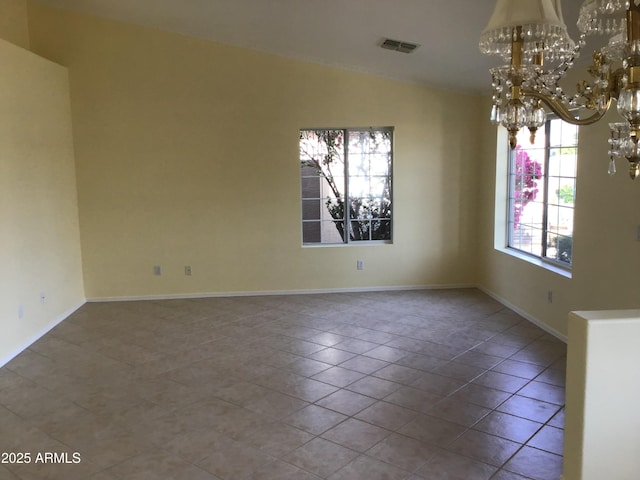 unfurnished dining area with visible vents, lofted ceiling, tile patterned floors, baseboards, and a notable chandelier
