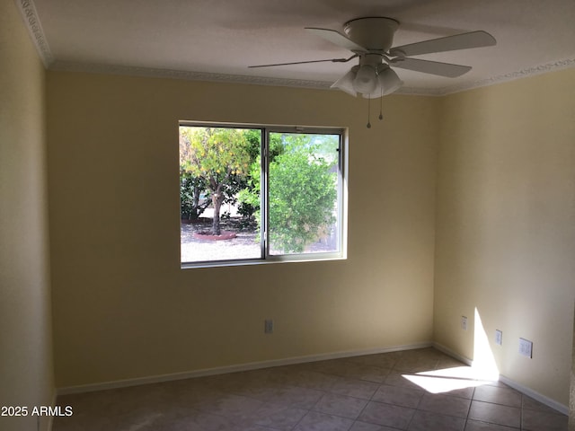 empty room featuring ornamental molding, a ceiling fan, tile patterned flooring, and a healthy amount of sunlight