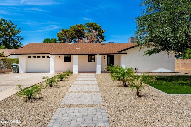 1304 W Ocotillo Rd, Phoenix, AZ 85013 - single story home with a garage, stucco siding, driveway, and a shingled roof