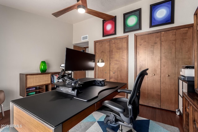 office with visible vents, a ceiling fan, and wood finished floors