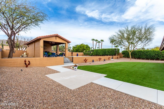 view of yard with a patio area and a fenced backyard