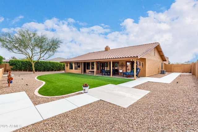 back of house with a patio, a fenced backyard, central AC, a tile roof, and stucco siding