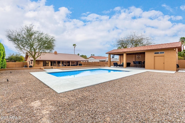 view of pool featuring a fenced in pool, a patio area, and a fenced backyard