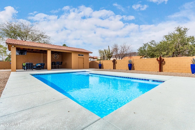 view of pool featuring a patio area, a fenced backyard, and a fenced in pool