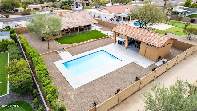 view of pool with a fenced backyard, a residential view, and a fenced in pool