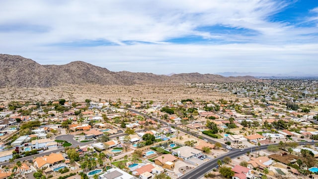 birds eye view of property with a mountain view and a residential view