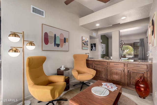 living area with visible vents and recessed lighting