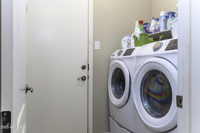 laundry area with separate washer and dryer