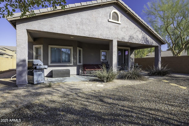 back of house with a patio area